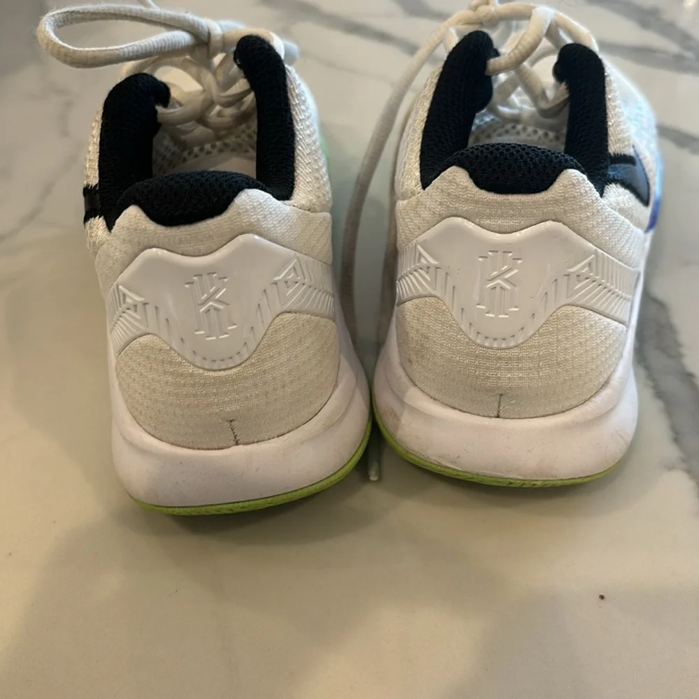 Gently used Nike Kyrie boys sneakers white black lime green and purple size 2.5